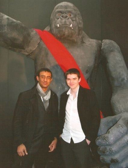 Zain Jaffer and his Vungle co-founder Jack standing in front of a large King Kong statue